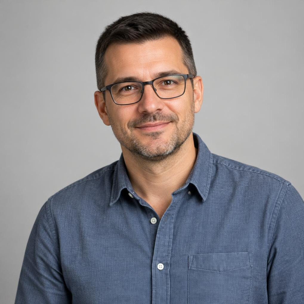 Portrait of a man in a shirt with glasses