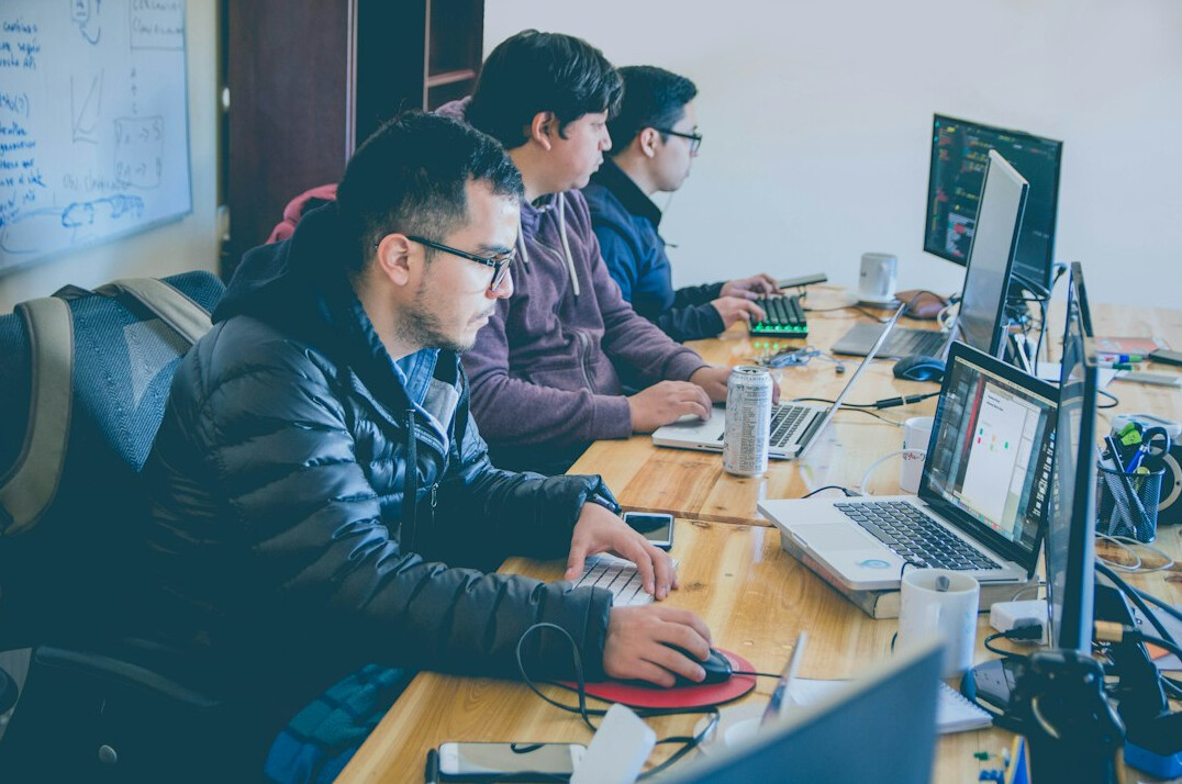 group of programmers coding